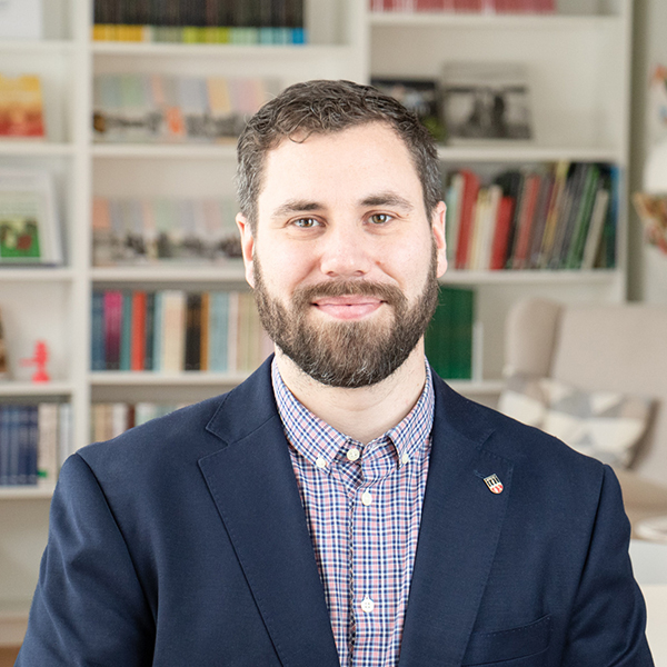 Grafik där en person håller armen om en annan. 